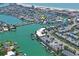 Stunning aerial view showcasing the property's prime waterfront location and boating access on a beautiful day at 291 115Th Ave, Treasure Island, FL 33706