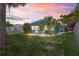 Charming backyard with patio and tropical landscaping, great for outdoor entertaining at 291 115Th Ave, Treasure Island, FL 33706