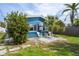 Charming backyard with a quaint patio and tropical landscaping, perfect for outdoor relaxation at 291 115Th Ave, Treasure Island, FL 33706