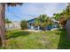 Lush backyard featuring a patio, perfect for enjoying the tropical surroundings at 291 115Th Ave, Treasure Island, FL 33706