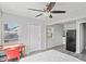 Open bedroom-kitchen layout, enhanced with a ceiling fan and ample natural light at 291 115Th Ave, Treasure Island, FL 33706