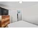Neat bedroom featuring minimalist design with a dresser, closet, and a mini-split AC unit at 291 115Th Ave, Treasure Island, FL 33706
