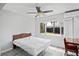 Bright, well-lit bedroom featuring a ceiling fan and laminate flooring at 291 115Th Ave, Treasure Island, FL 33706