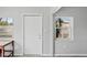 Bright entryway with natural light, featuring a white door and neutral decor at 291 115Th Ave, Treasure Island, FL 33706