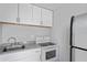Well-lit kitchen featuring granite counters and stainless steel appliances at 291 115Th Ave, Treasure Island, FL 33706