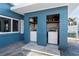 Outdoor laundry room featuring washer and dryer units within a covered space at 291 115Th Ave, Treasure Island, FL 33706