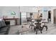 Inviting living space with stainless steel appliances and a round dining table at 291 115Th Ave, Treasure Island, FL 33706