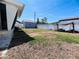 A spacious backyard with a detached garage offers potential for various outdoor activities at 3243 Bayport Dr, Holiday, FL 34691