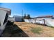 Wide view of backyard showing an old shed and a new fence at 3243 Bayport Dr, Holiday, FL 34691