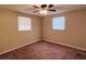 Bedroom with two windows, neutral paint and carpet flooring at 3243 Bayport Dr, Holiday, FL 34691