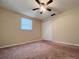 Bedroom with ceiling fan, neutral paint, window and closet at 3243 Bayport Dr, Holiday, FL 34691