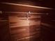 Close-up of a well-organized wooden closet with a built-in hanging rod at 3243 Bayport Dr, Holiday, FL 34691