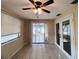 Dining room features tile floors, large windows, and sliding glass door to the sunroom at 3243 Bayport Dr, Holiday, FL 34691