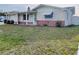 Charming single-story home with a well-maintained lawn and tidy landscaping at 3243 Bayport Dr, Holiday, FL 34691