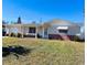 Charming single-story home with a well-maintained lawn and tidy landscaping at 3243 Bayport Dr, Holiday, FL 34691