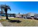 Charming single-story home with a well-maintained lawn and tidy landscaping at 3243 Bayport Dr, Holiday, FL 34691