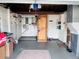 Spacious garage with ample storage, shelving, and a gray floor at 3243 Bayport Dr, Holiday, FL 34691