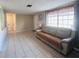 Comfortable living room with tile floors, bright windows, and neutral decor at 3243 Bayport Dr, Holiday, FL 34691