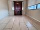 Cozy living room with tile floors and a dark wood entertainment center for ample storage and display at 3243 Bayport Dr, Holiday, FL 34691