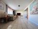 Bright living room with tile floors, a comfortable sofa, and a flat-screen television at 3243 Bayport Dr, Holiday, FL 34691