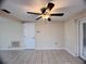 Bright room featuring a modern ceiling fan, tile flooring, and neutral wall color at 3243 Bayport Dr, Holiday, FL 34691