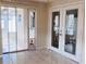 Sun room featuring tile floors, doggie doors and glass doors to the outside at 3243 Bayport Dr, Holiday, FL 34691