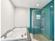 Modern bathroom with large tub, glass shower, and stylish tiling at 3255 Meadow View Ln, Palm Harbor, FL 34683