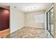 Bright dining room featuring tile floors, hanging light fixture, and sliding doors at 3255 Meadow View Ln, Palm Harbor, FL 34683