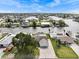Aerial view of a waterfront neighborhood with a home featuring a pool, dock, and landscaped yard at 3328 Gulfview Dr, Hernando Beach, FL 34607