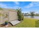 A shed in the backyard near the water with plants around it at 3328 Gulfview Dr, Hernando Beach, FL 34607
