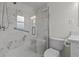Elegant bathroom features glass shower, custom tiling, and custom shower fixtures at 3328 Gulfview Dr, Hernando Beach, FL 34607