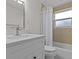 Bathroom with a single sink vanity, tile surround and a shower-tub combination at 3328 Gulfview Dr, Hernando Beach, FL 34607