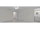 Large bedroom with white walls, ceiling fan, light wood floors, and adjoined bathroom at 3328 Gulfview Dr, Hernando Beach, FL 34607