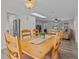 Open dining room featuring a wooden table, tile floors, and natural light at 3328 Gulfview Dr, Hernando Beach, FL 34607
