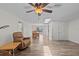 Spacious living room with ceiling fan, tile floors, and views of the dining room at 3328 Gulfview Dr, Hernando Beach, FL 34607