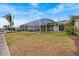 Screened-in pool with a waterside tiki bar at 3328 Gulfview Dr, Hernando Beach, FL 34607