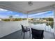 Balcony with seating offering beautiful views of the water and surrounding landscape at 3344 Gardenia Dr, Hernando Beach, FL 34607