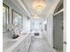 Bright bathroom with dual vanity, soaking tub, and glass-enclosed shower at 3344 Gardenia Dr, Hernando Beach, FL 34607