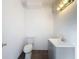 Clean half-bathroom with modern vanity and toilet against a simple, bright backdrop at 3344 Gardenia Dr, Hernando Beach, FL 34607
