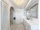 Bright bathroom with dual vanity, glass-enclosed shower, and modern fixtures at 3344 Gardenia Dr, Hernando Beach, FL 34607