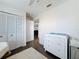Bedroom featuring a closet with folding doors and a changing table at 3344 Gardenia Dr, Hernando Beach, FL 34607