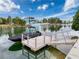 Waterfront property featuring a private boat dock and tranquil canal views at 3344 Gardenia Dr, Hernando Beach, FL 34607