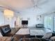 Open living area with comfortable seating, a ceiling fan, and access to the outdoor balcony at 3344 Gardenia Dr, Hernando Beach, FL 34607
