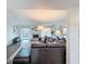 Bright living room boasts a cozy fireplace, ceiling fan and a large leather sectional sofa at 3344 Gardenia Dr, Hernando Beach, FL 34607