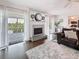 Bright and airy living room with a fireplace, outside views, and seamlessly connected to the kitchen at 3344 Gardenia Dr, Hernando Beach, FL 34607