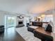 Open-concept living area with a fireplace, sliding doors to the outside, and neutral decor at 3344 Gardenia Dr, Hernando Beach, FL 34607