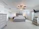 Large main bedroom with ensuite bath, ceiling fan, and exterior access to a balcony at 3344 Gardenia Dr, Hernando Beach, FL 34607