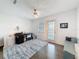 Bright office space with a desk, chair, and outdoor access, with a ceiling fan and laminate flooring at 3344 Gardenia Dr, Hernando Beach, FL 34607
