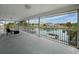 Enjoy waterfront views from the screened porch with plenty of space for outdoor seating at 3344 Gardenia Dr, Hernando Beach, FL 34607