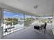 Enjoy waterfront views from the screened porch with plenty of space for outdoor seating at 3344 Gardenia Dr, Hernando Beach, FL 34607
